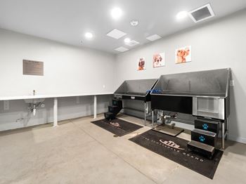 a large room with a piano and a sink in it at Scottsdale Grand, Scottsdale